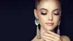 Fashion-girl-close-eyes-earring-black-background 1600x900